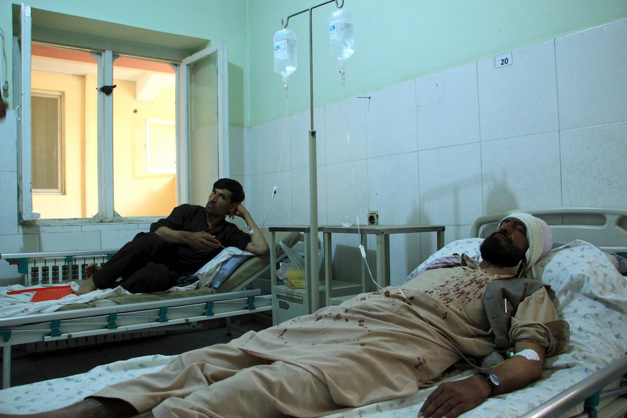 Injured workers from the HALO Trust de-mining organisation are treated at a hospital in northern Baghlan province, Afghanistan, June 9. Workers of the organisation were attacked on Tuesday night by the armed gunmen. Photo: AP