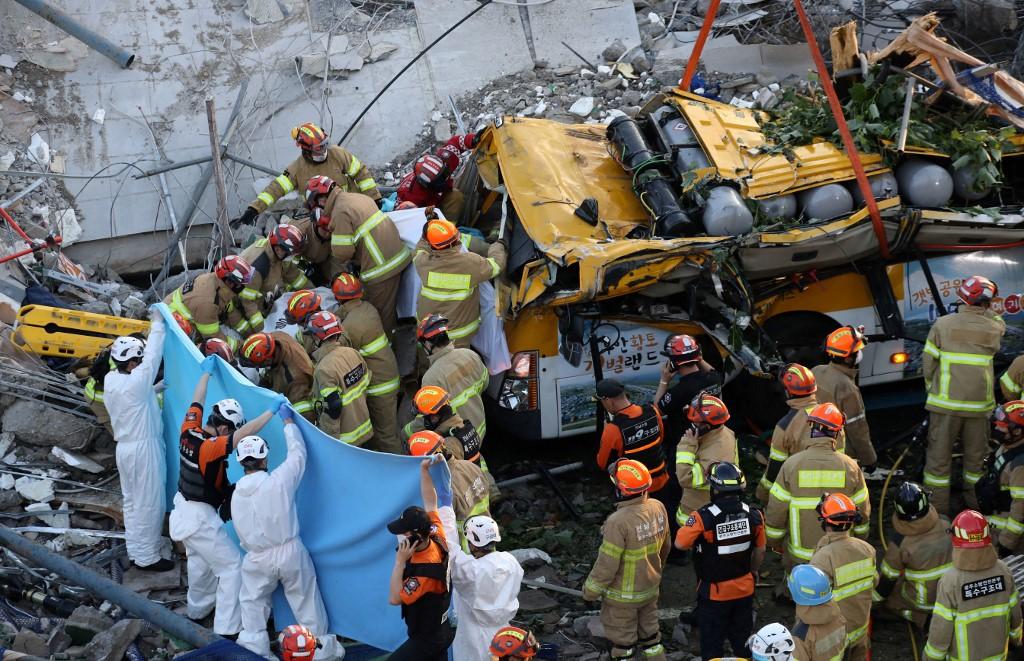South Korean rescue workers search for possible survivors from the debris of a collapsed building in Gwangju on June 9. Photo: AFP