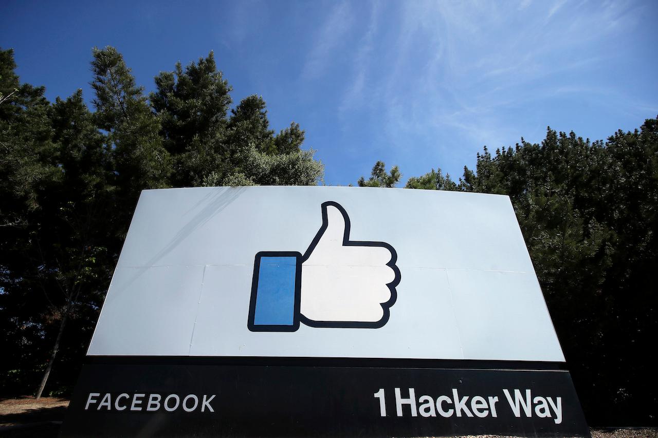 The thumbs up Like logo is shown on a sign at Facebook headquarters in Menlo Park, California, in this April 14, 2020 file photo. Facebook's workforce totals about 60,000. Photo: AP