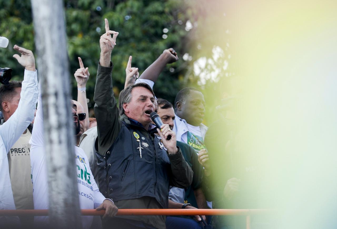 Brazil's President Jair Bolsonaro talks to supporters after joining a caravan of motorcycle enthusiasts through the streets of the city, organised to show support for him, in Sao Paulo, Brazil, June 12. Photo: AP