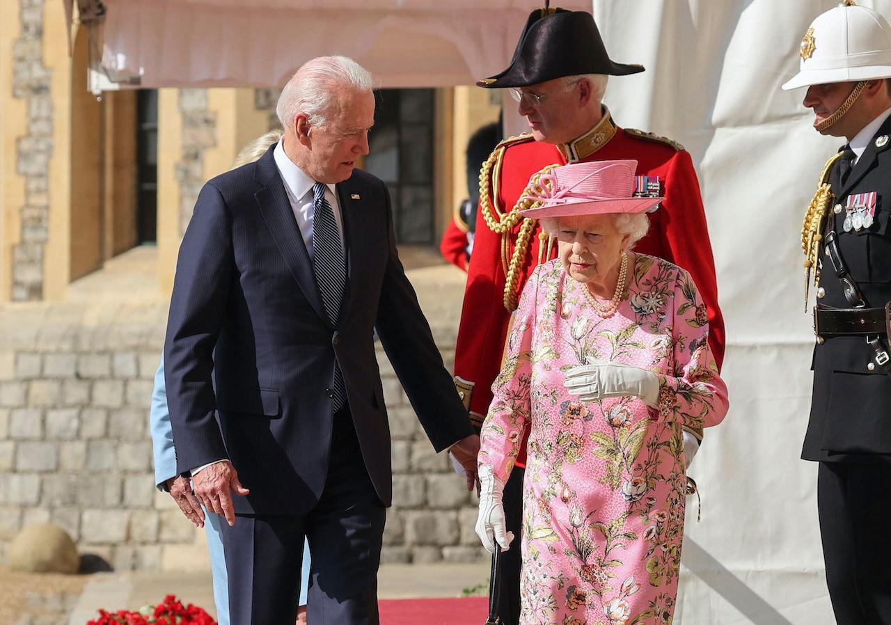 Britain's Queen Elizabeth II (right) walks with US President Joe Biden during his visit to Windsor Castle, near London, June 13. Photo: AP