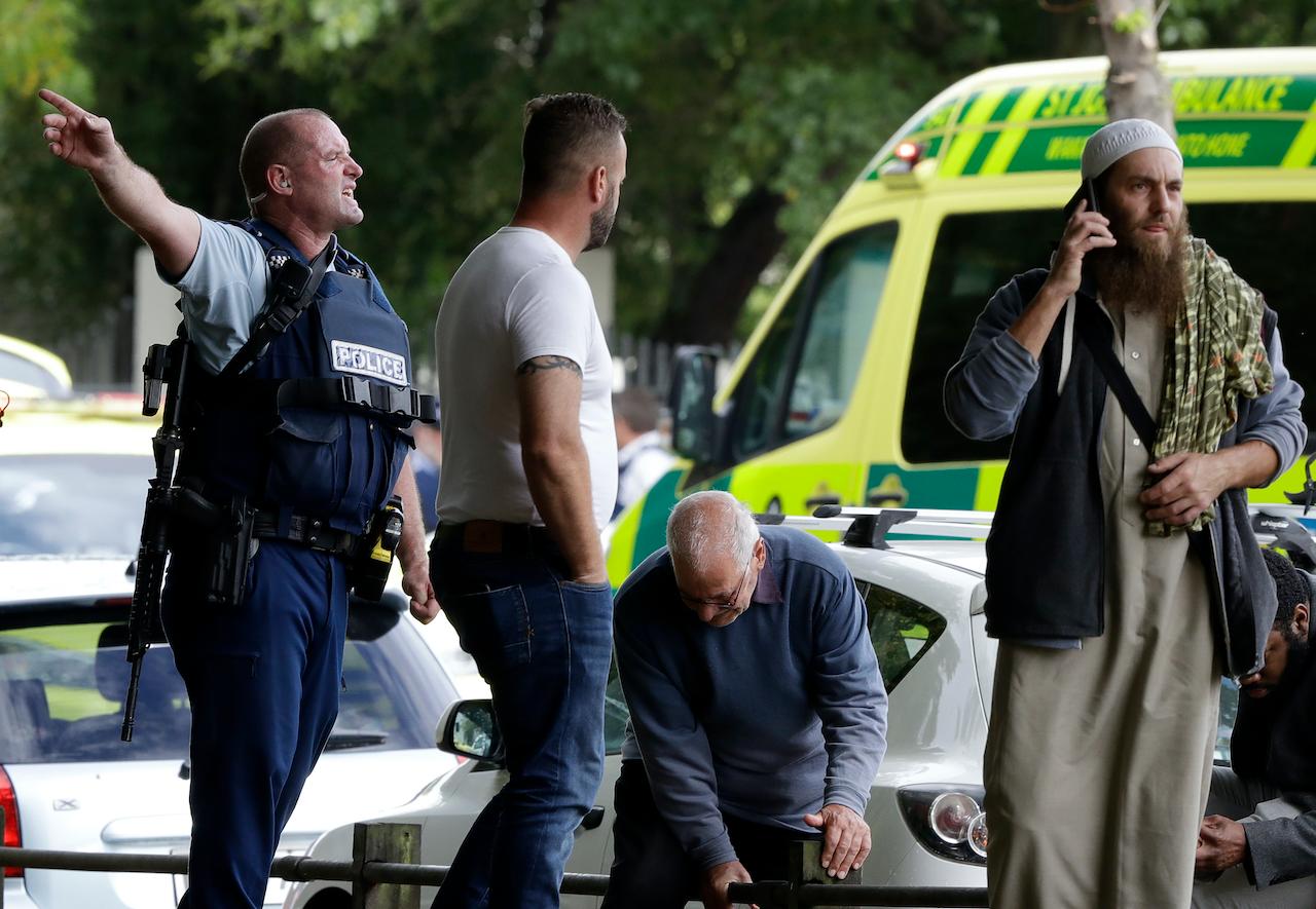 Police attempt to clear people from outside a mosque in central Christchurch, New Zealand, in this March 15, 2019 file photo. Tentative plans for a movie that recounts the response of New Zealand Prime Minister Jacinda Ardern to a gunman's slaughter of Muslim worshippers has drawn criticism for not focusing on the victims of the attacks. Photo: AP