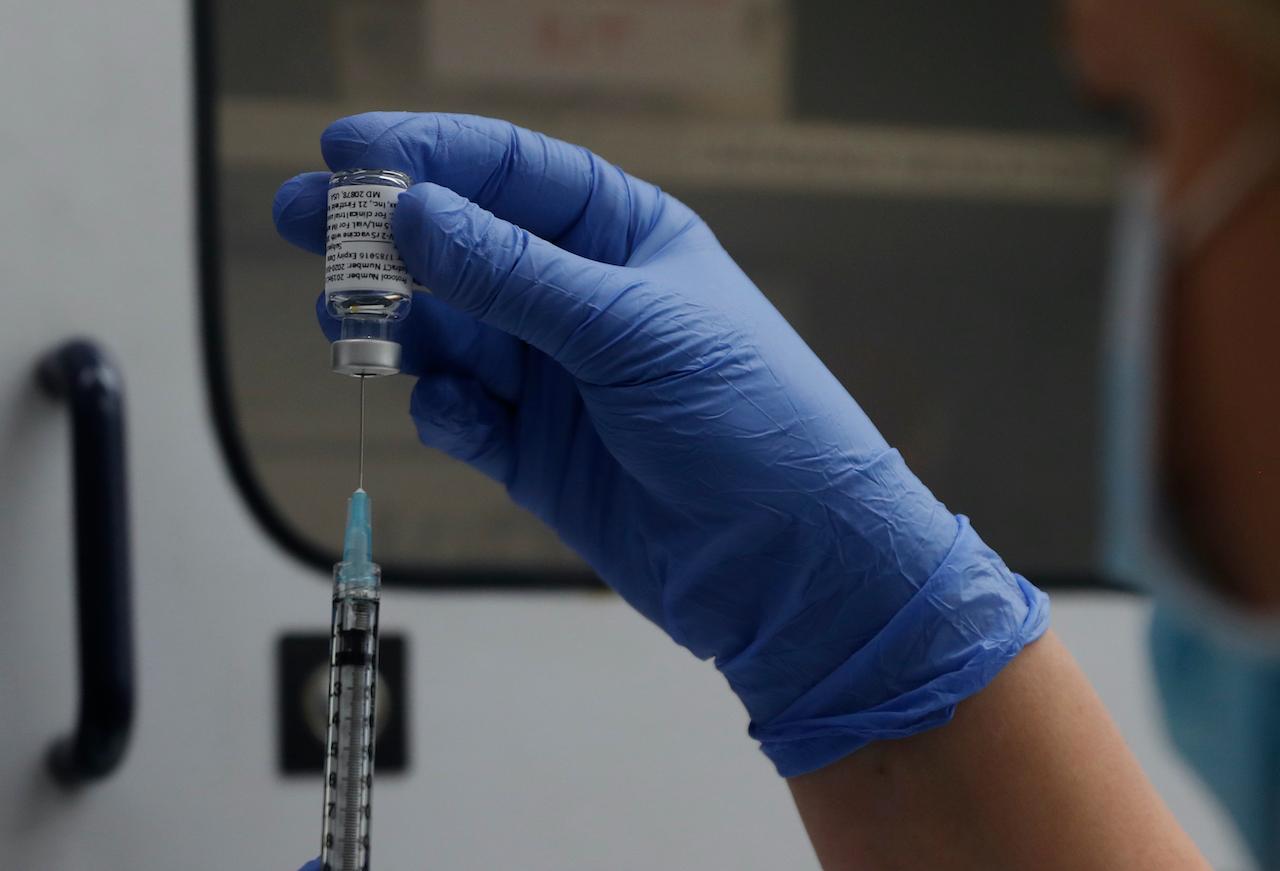 A vial of the Phase 3 Novavax coronavirus vaccine is seen ready for use in a trial at St George's University hospital in London, Oct 7, 2020. Photo: AP