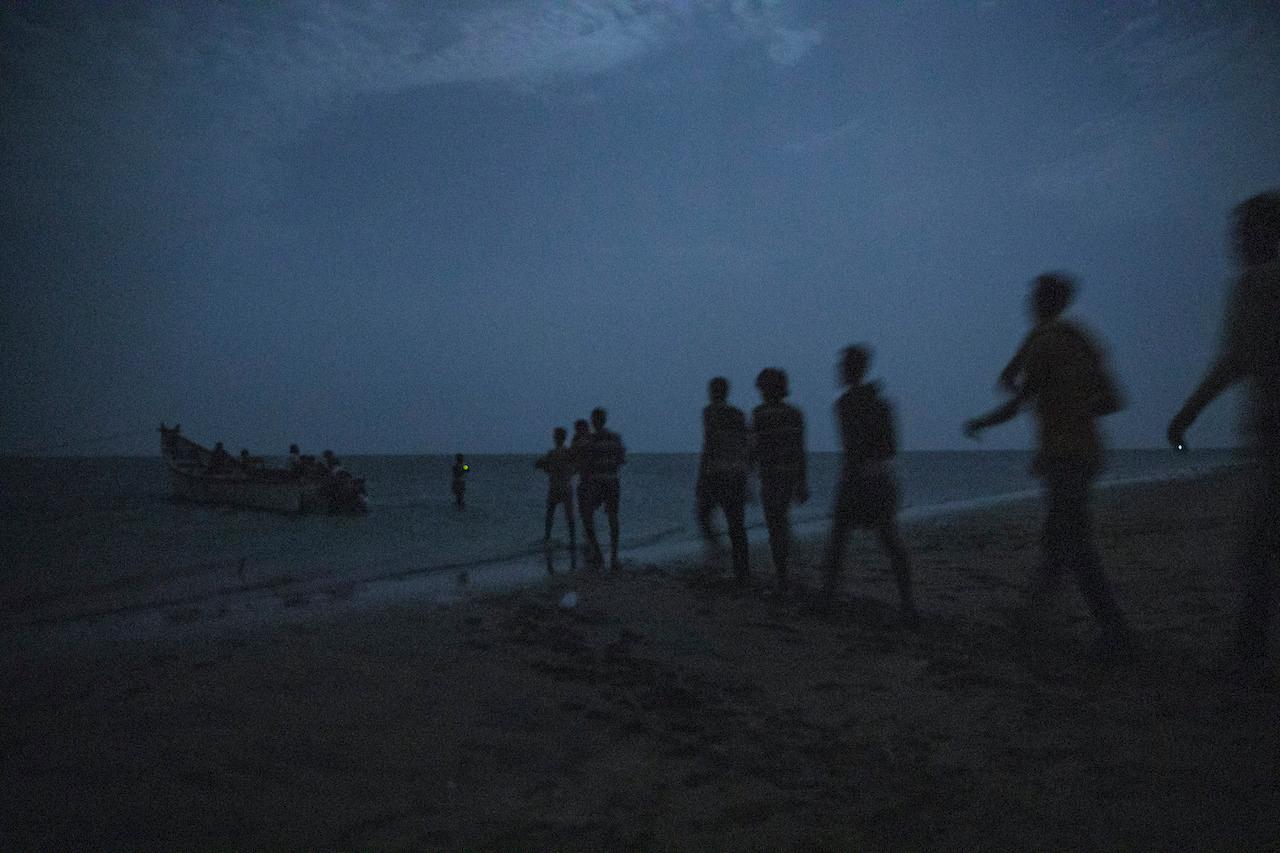 Ethiopian migrants line up to board a small boat in the uninhabited coast outside the town of Obock, Djibouti, in this July 15, 2019 file photo. African migrants continue to make the dangerous trip to Yemen in the hopes of finding work in Saudi Arabia and other neighbouring oil-rich states. Photo: AP