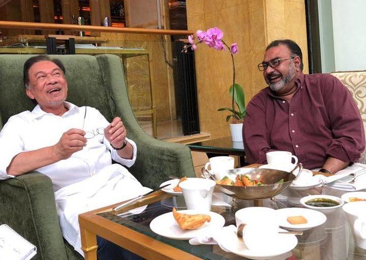 Vinod Sekhar shares a light-hearted moment with Anwar Ibrahim, in this photo taken in 2019. Vinod is an ardent supporter of the PKR president. Photo: Facebook