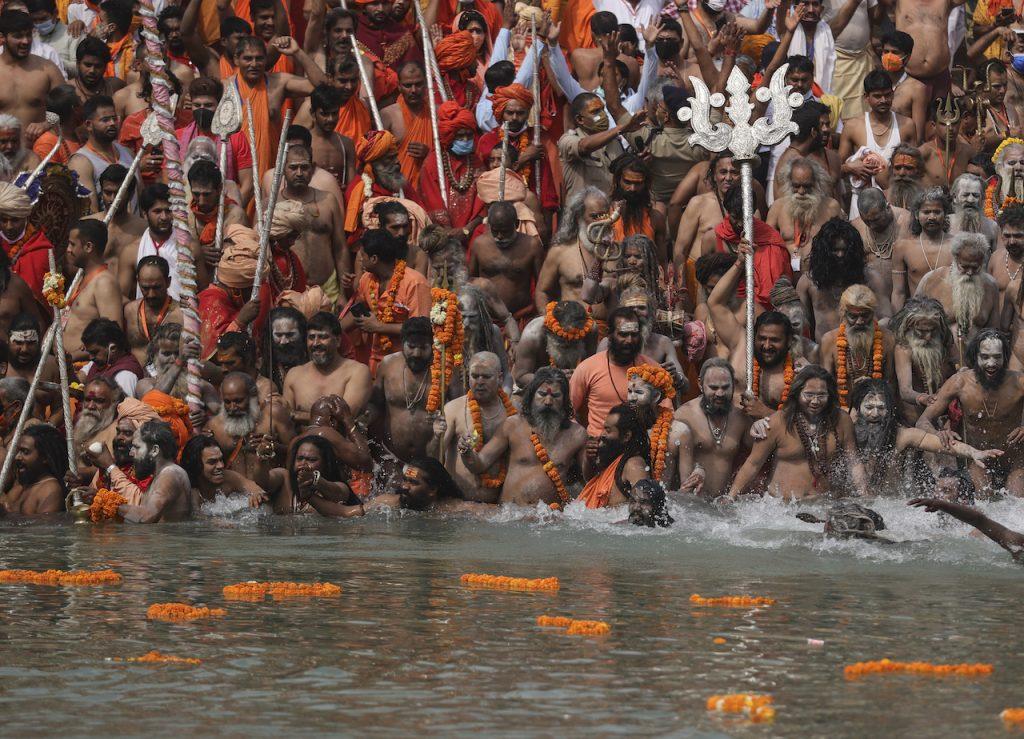 Hindu holy men take a dip in the Ganges River during Kumbh Mela, or the pitcher festival, one of the most sacred pilgrimages in Hinduism, in Haridwar, northern state of Uttarakhand, India, April 12. Photo: AP