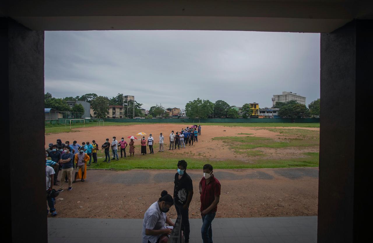 Sri Lankans line up to receive Sinopharm vaccine for Covid-19 at a military-run vaccination centre set up at a playground in Colombo, Sri Lanka, May 15. Photo: AP