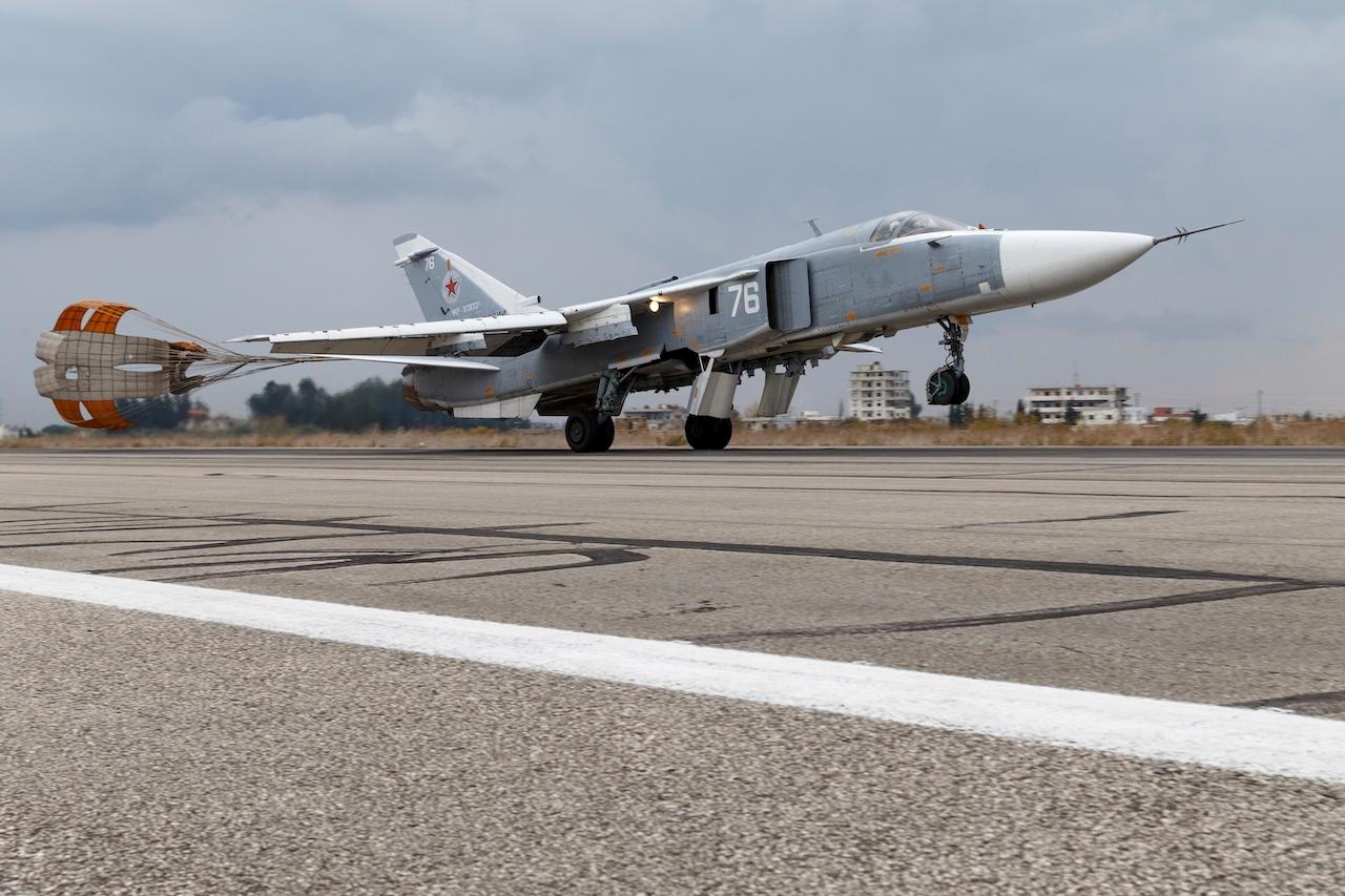 A Russian Su-24 bomber lands at Hemeimeem air base in Syria in this Dec 16, 2015 file photo. The Russian military says its warship has fired warning shots and a warplane dropped bombs to force a British destroyer from Russia's waters near Crimea in the Black Sea on June 23. Photo: AP