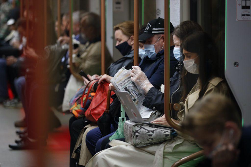 People wearing face masks to help curb the spread of the coronavirus ride a subway car in Moscow, Russia, June 10. Photo: AP
