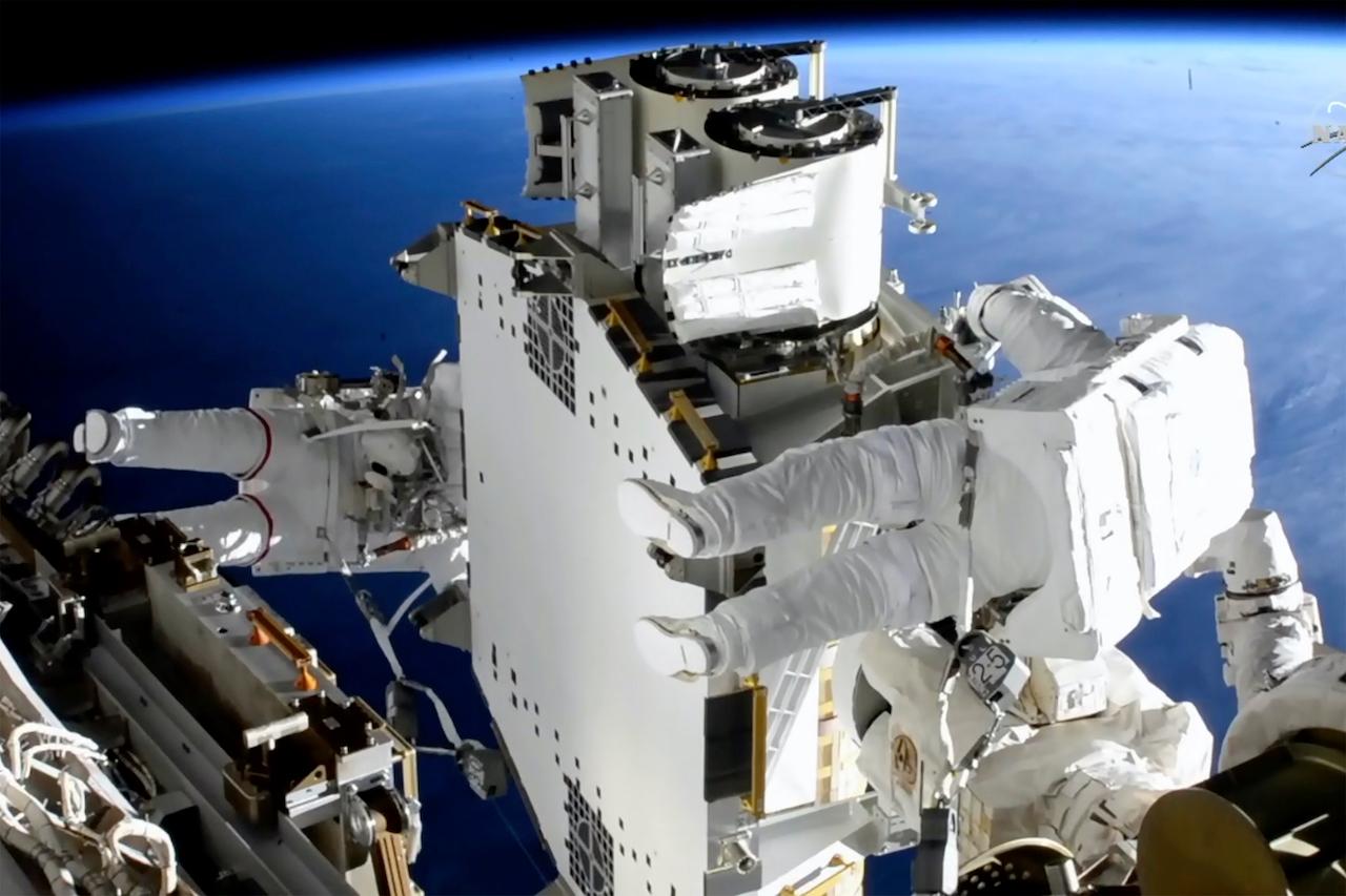 Astronauts work outside the International Space Station in this June 20 image taken from Nasa video. Photo: AP