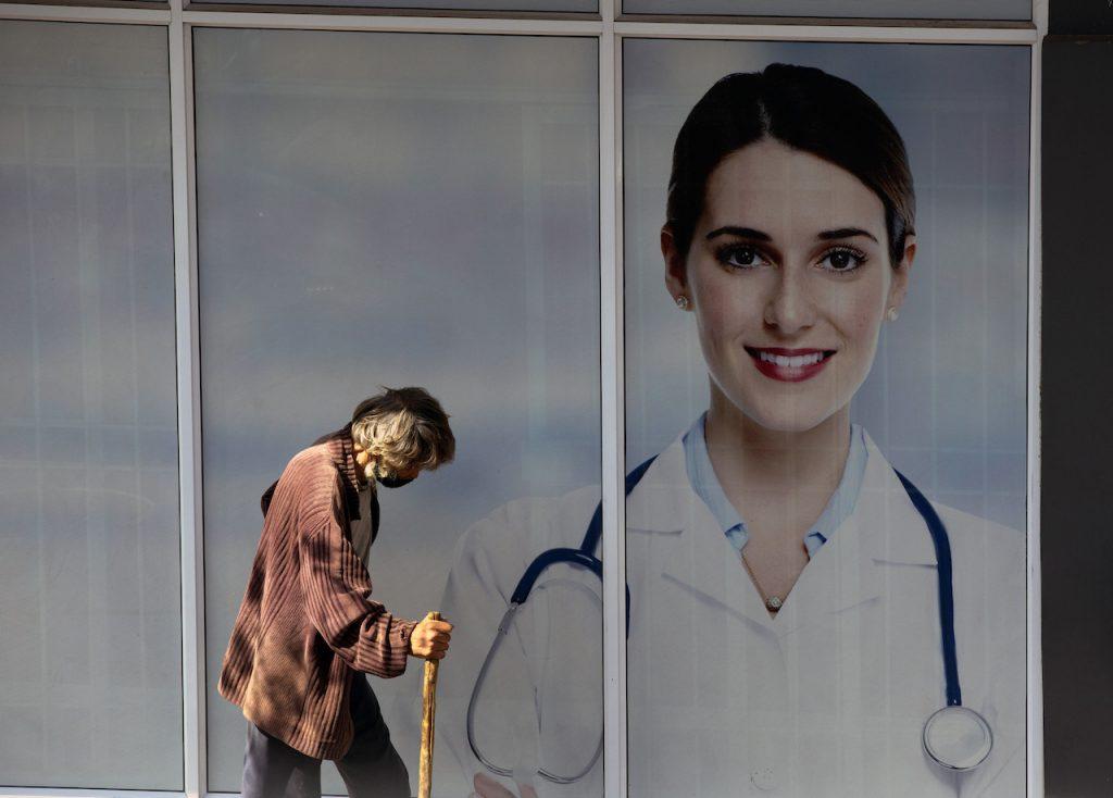 A man passes doctors' consulting rooms in Johannesburg, April 16. South Africa recorded more than 15,000 new Covid-19 cases on Sunday including 122 deaths, bringing its total fatalities to nearly 60,000. Photo: AP