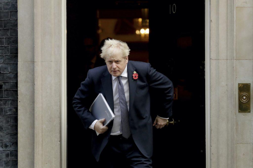 British Prime Minister Boris Johnson leaves 10 Downing Street in London in this file photo taken Nov 10, 2020. Johnson is reportedly backing plans for a bill that will allow the UK to hold asylum seekers in Australian-style offshore processing centres after the arrival of several hundred migrants last weekend. Photo: AP