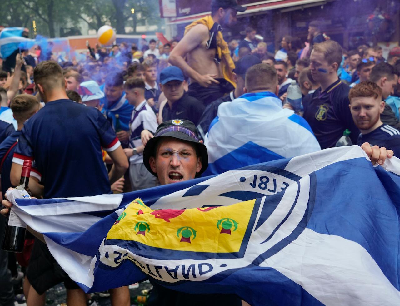 Scotland fans gather in Leicester Square prior to the Euro 2020 football championship group D match between England and Scotland, in London, June 18. Scottish authorities have reported nearly 2,000 coronavirus cases linked to watching European Championship games in stadiums, public gatherings, pubs or private homes. Photo: AP