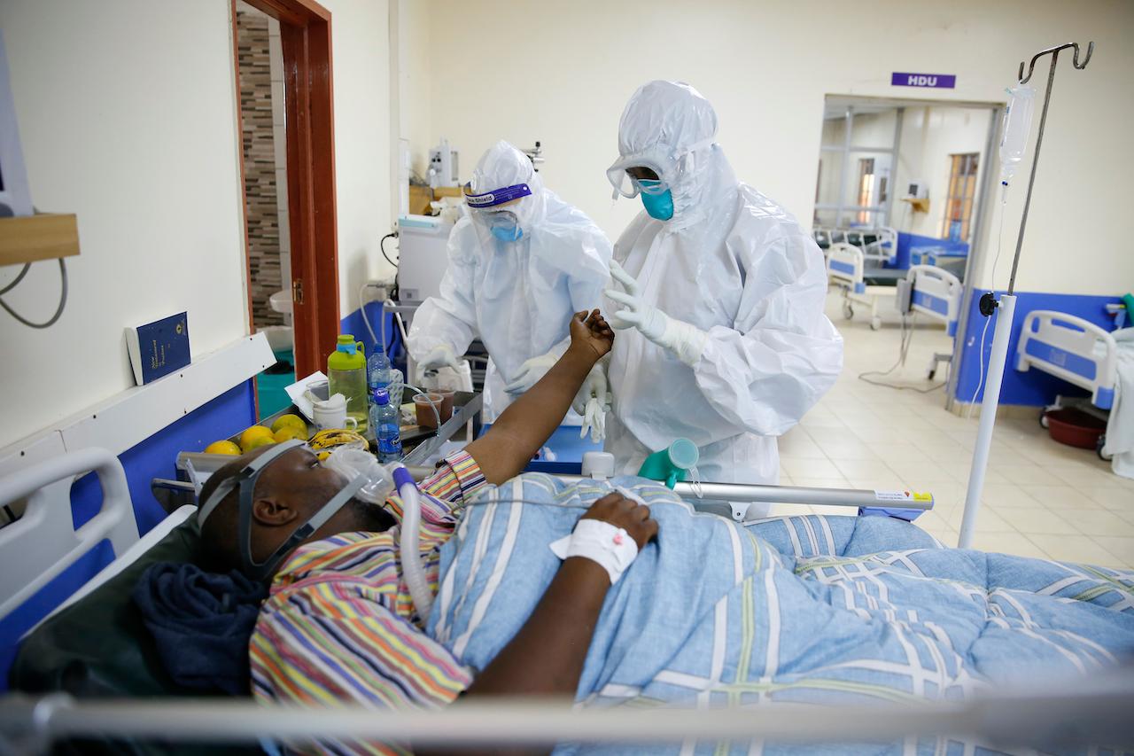 Medical staff wearing protective equipment attend to patients affected by Covid-19, at the ICU of the Machakos County Level-5 hospital in Machakos, Kenya, June 17. Photo: AP