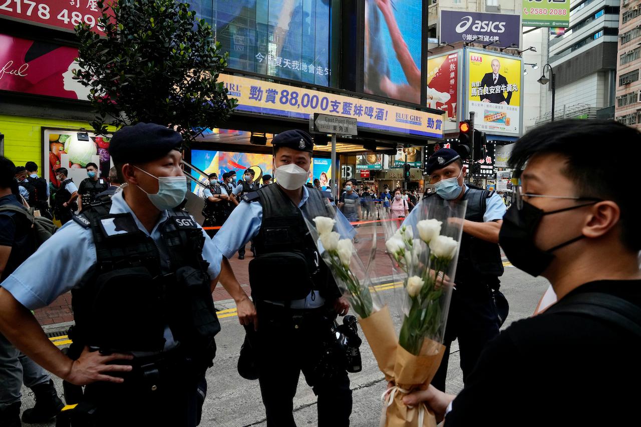 Advocating members of the public to mourn for the attacker is no different from supporting terrorism, Hong Kong police say.