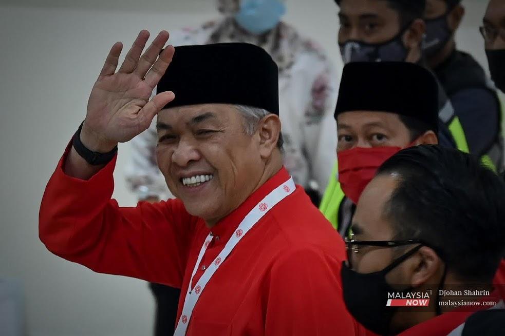 Umno president Ahmad Zahid Hamidi waves as he leaves the World Trade Centre in Kuala Lumpur after the party's general assembly on March 28.