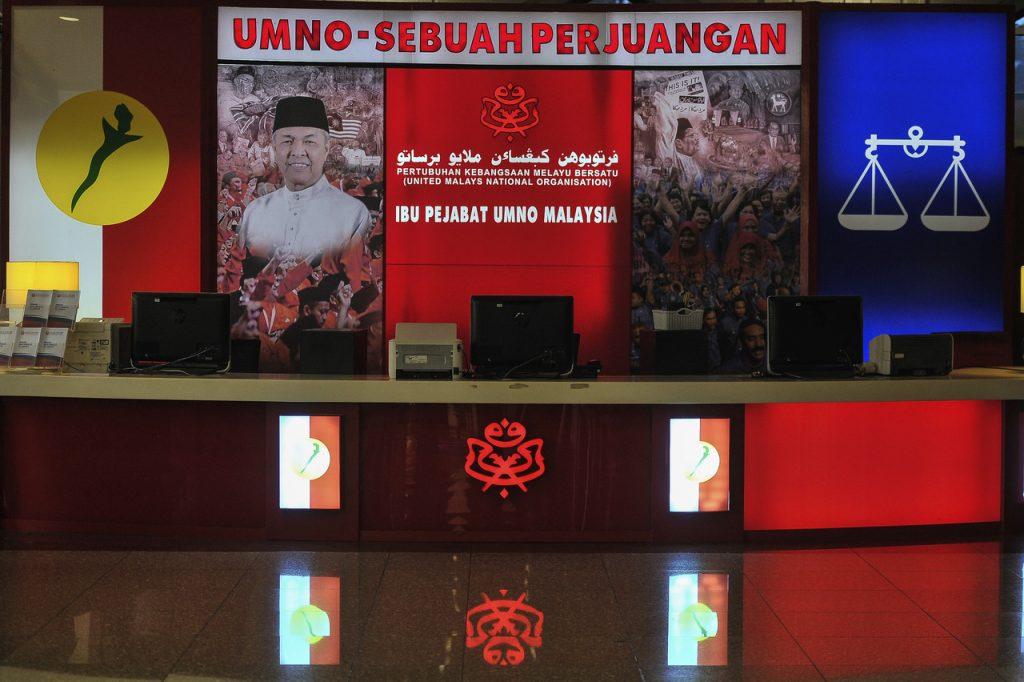 The Barisan Nasional logo seen beside a picture of Umno president Ahmad Zahid Hamidi at the party's headquarters in Kuala Lumpur. Photo: Bernama