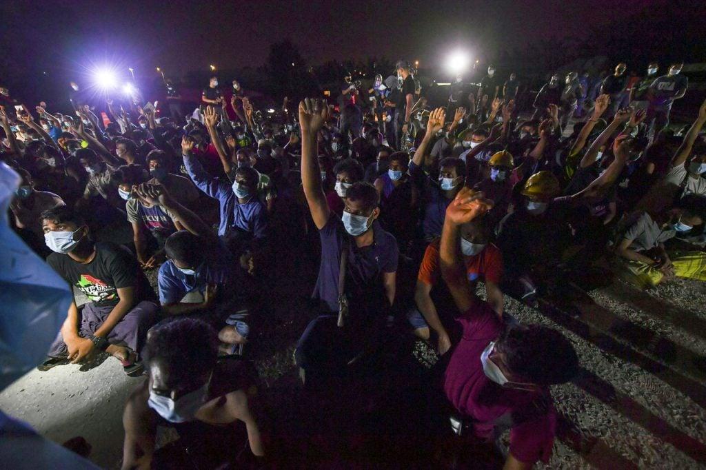 A group of foreign workers detained in an immigration crackdown in Cyberjaya on June 7. Photo: Bernama