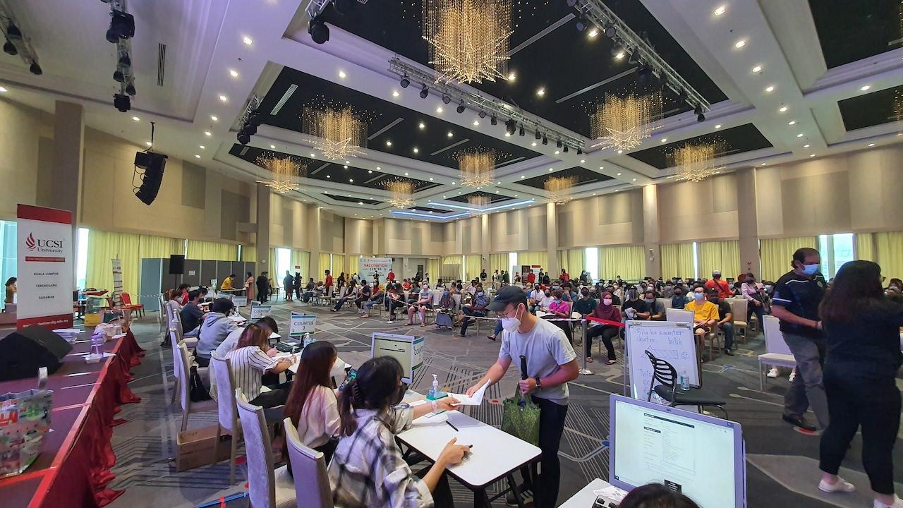 Frontline workers at their stations at the UCSI vaccination centre.