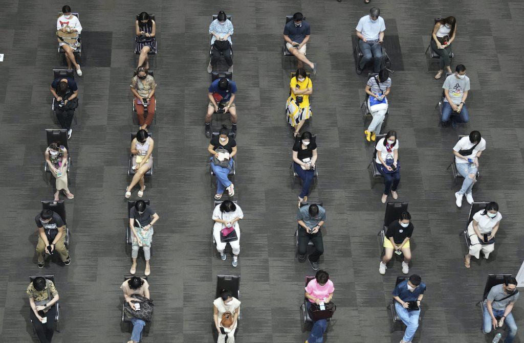 People wait to be given doses of the AstraZeneca Covid-19 vaccine at Paragon shopping mall in Bangkok, Thailand, June 7. Photo: AP