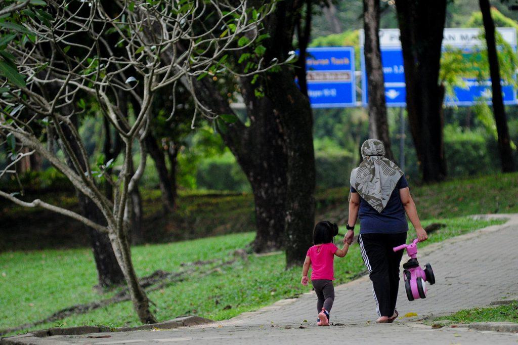 Family spats due to financial problems have been identified as one of the factors leading to child abuse cases. Photo: Bernama