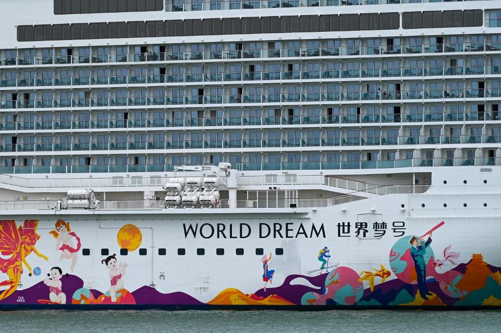 People are seen onboard the Dream Cruises' World Dream cruise ship docked at the Marina Bay Cruise Centre in Singapore on July 14, after it returned to the city-state following a passenger's positive test for Covid-19. Photo: AFP