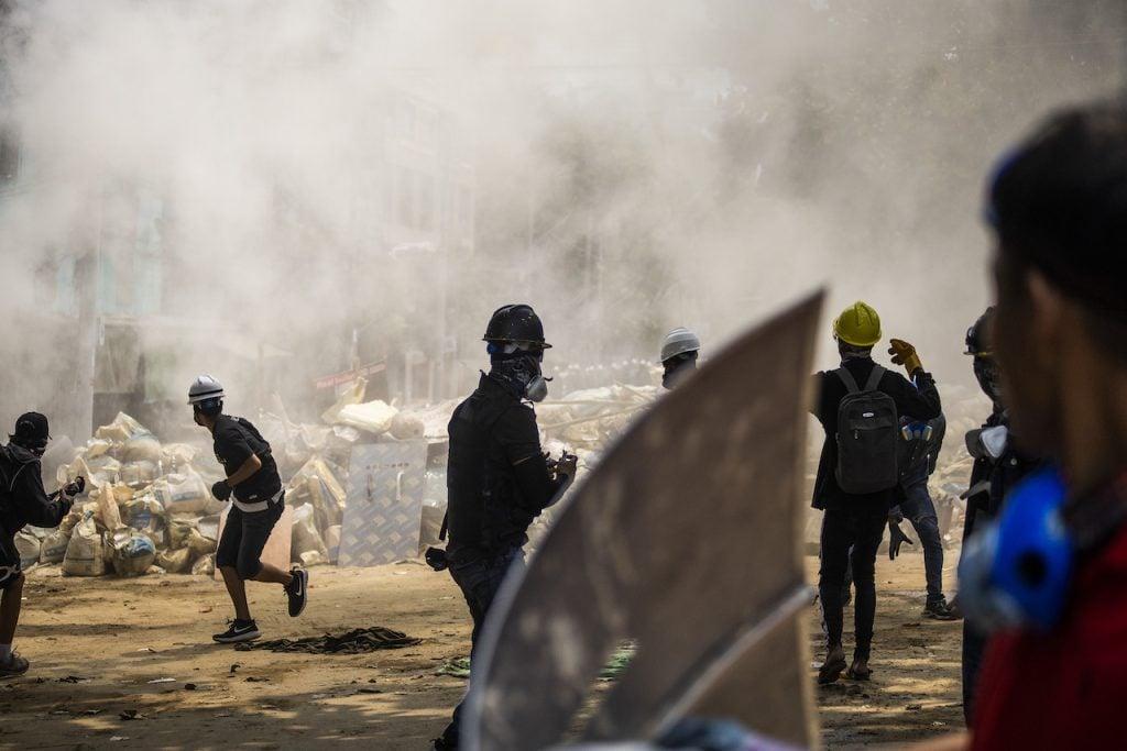 Anti-coup protesters scatter during the ongoing police crackdown during a protest in Sanchaung township, Yangon, Myanmar, on March 14. Photo: AP