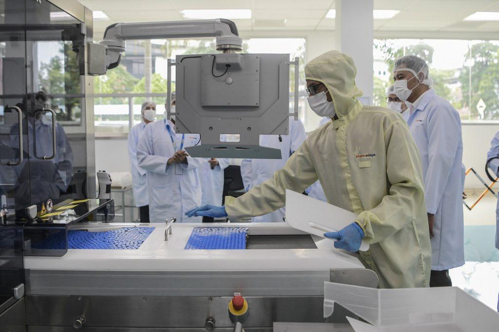 Workers fill vials with the Sinovac Covid-19 vaccine at Pharmaniaga Lifescience Sdn Bhd on May 23. Photo: Bernama