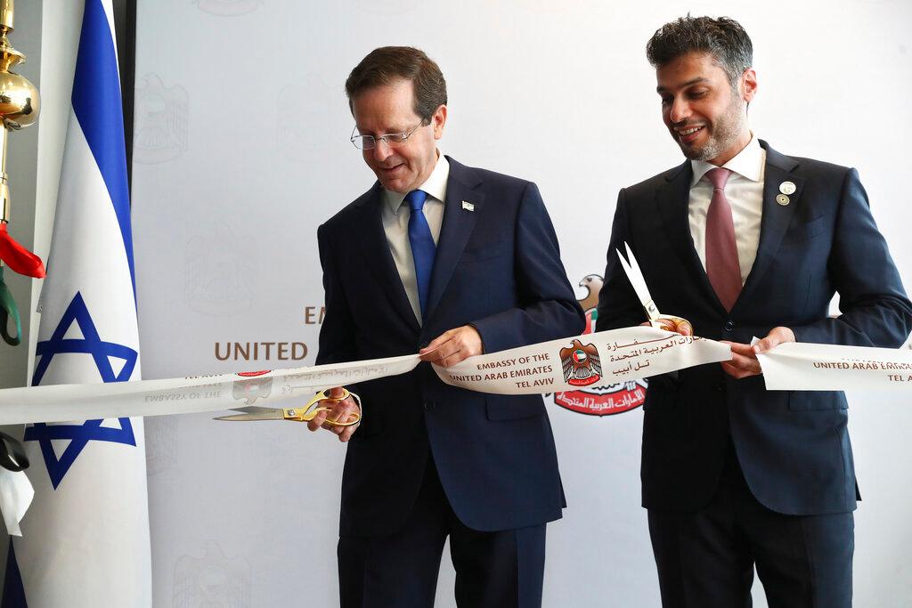 Israel's President Isaac Herzog (left) cuts a ribbon with United Arab Emirates ambassador to Israel Mohamed Al Khaja during the opening ceremony for the new UAE embassy in Tel Aviv, Israel, July 14. Photo: AP