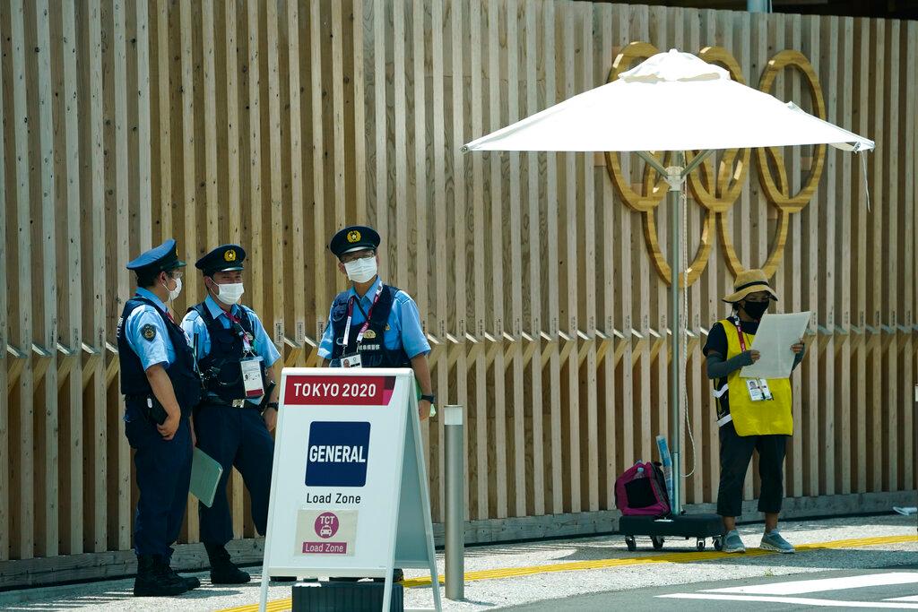 Police officers stand near the entrance to the athlete's village for the 2020 Summer Olympics and Paralympics in Tokyo, July 15. Photo: AP