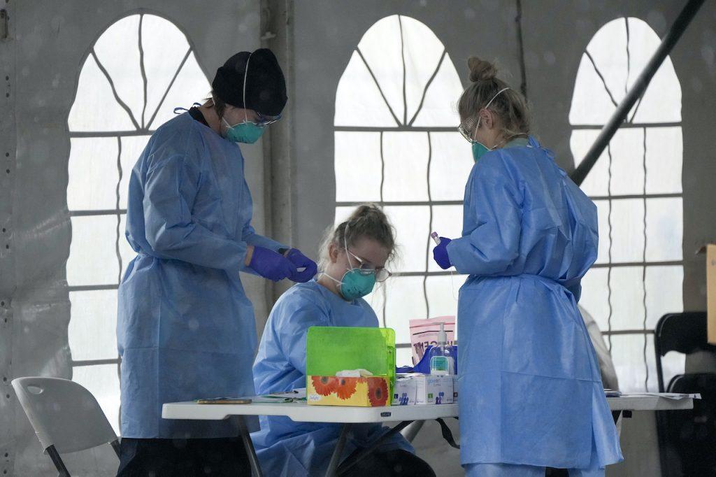Staff prepare to take Covid-19 tests at a testing station in Nelson Bay, Australia, June 28. Australia is battling to contain several Covid-19 clusters around the country in what some experts have described as the nation’s most dangerous stage of the pandemic since the earliest days. Photo: AP