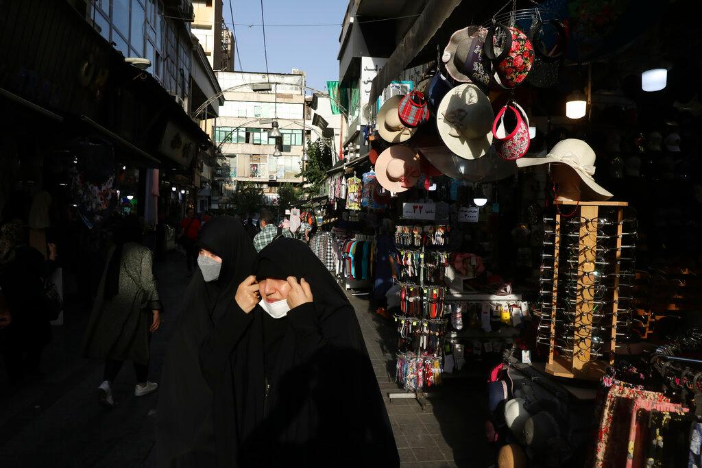People walk around in a commercial district in downtown Tehran, Iran, July 17. Photo: AP