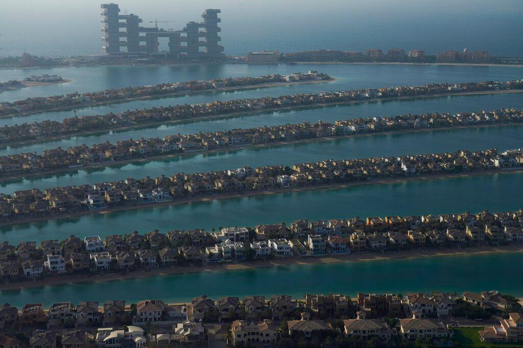 The fronds of the manmade Palm Jumeirah archipelago stretch out across the Persian Gulf with The Royal Atlantis Resort & Residences looming in the background in Dubai, United Arab Emirates, July 19. Photo: AP