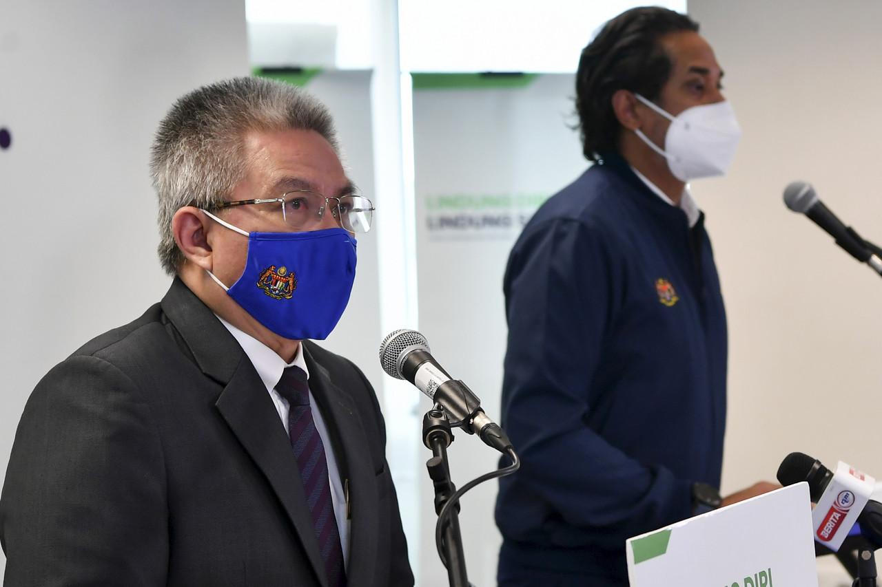 Health Minister Dr Adham Baba with National Covid-19 Immunisation Programme coordinating minister Khairy Jamaluddin. Photo: Bernama