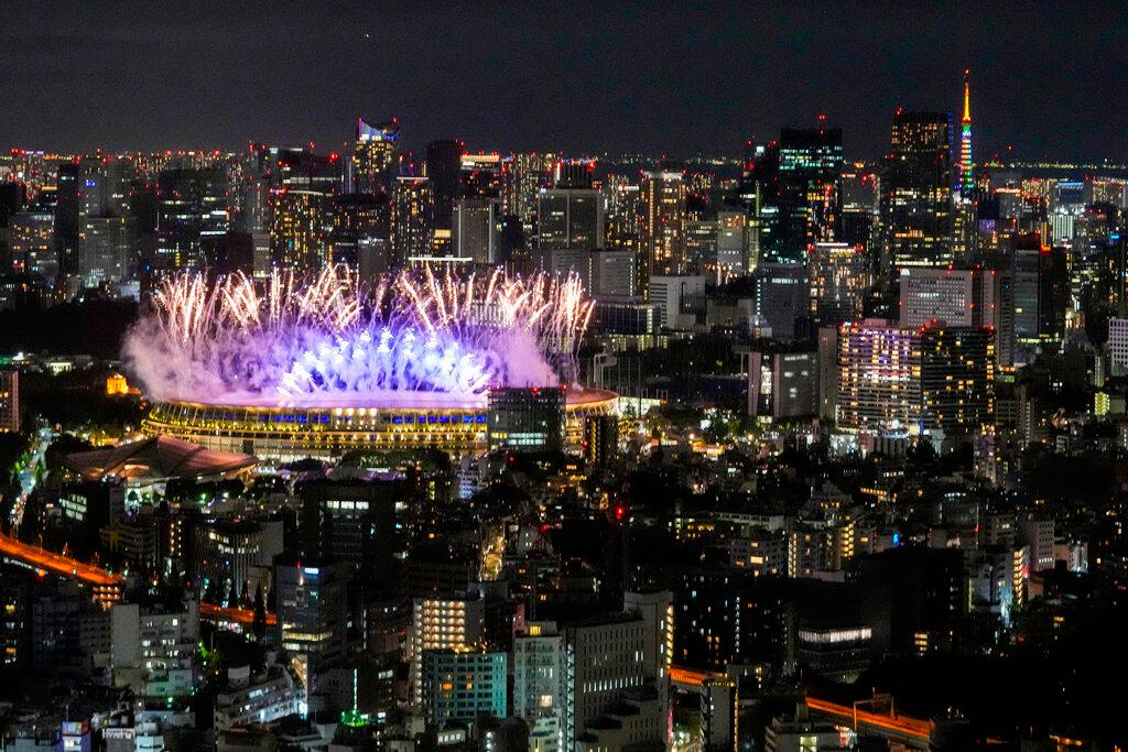 Fireworks burst over the National Stadium during the opening ceremony of the 2020 Tokyo Olympics, July 23. Photo: AP