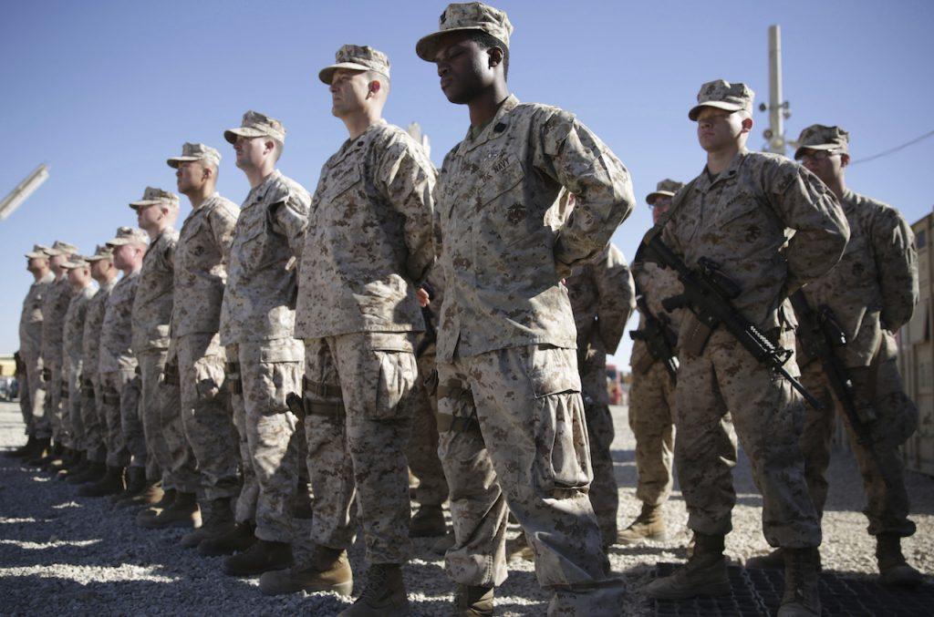 US marines watch during the change of command ceremony at Task Force Southwest military field in Shorab military camp of Helmand province, Afghanistan, Jan 15, 2018. The US aims to complete its withdrawal from Afghanistan by Sept 11. Photo: AP