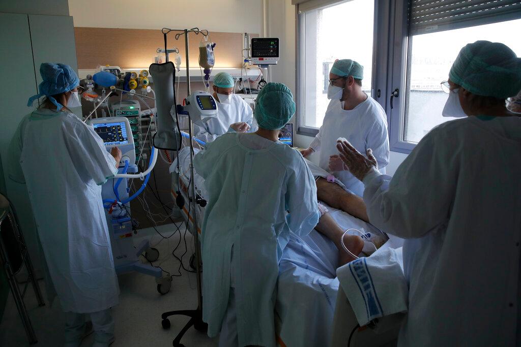 Medical staff tend to a Covid-19 patient in the ICU unit at the Charles Nicolle public hospital in Rouen, Normandy, in this April 15 file photo. Photo: AP