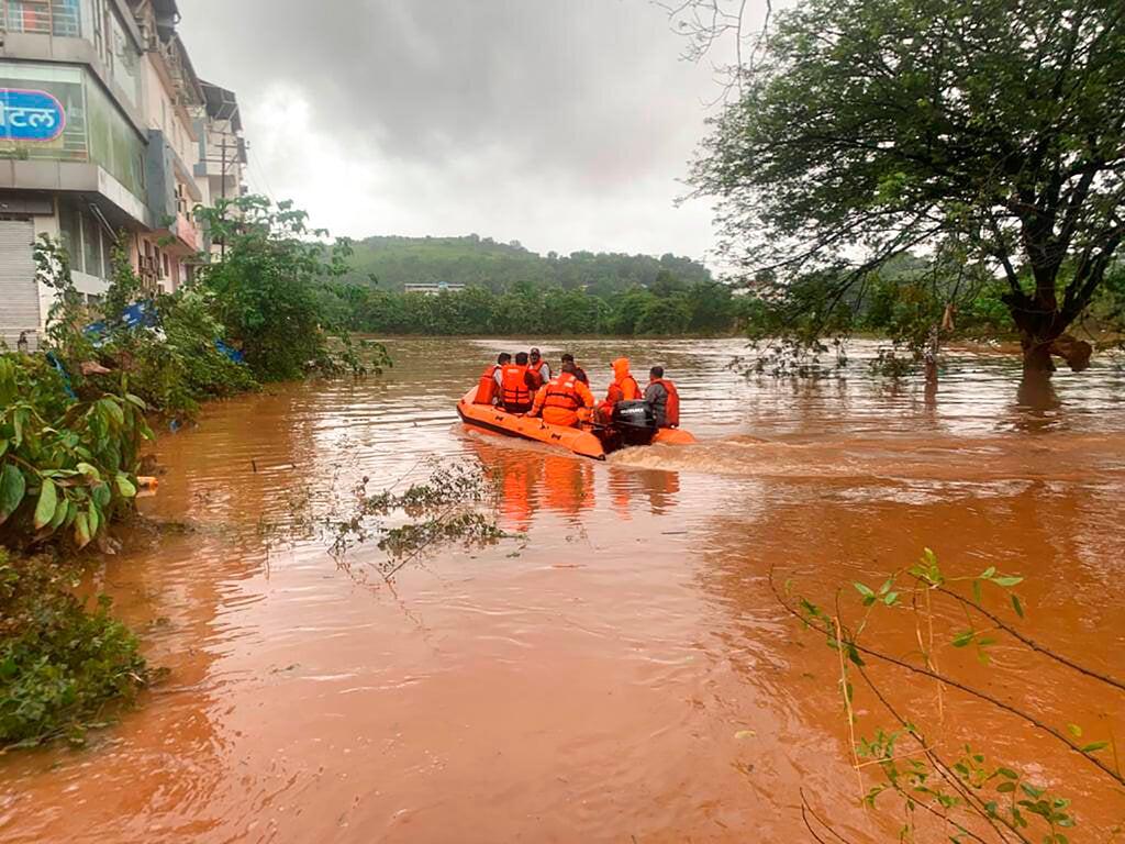 This photograph provided by India's National Disaster Response Force shows NDRF personnel rescuing residents in Chiplun area in the western Indian state of Maharashtra, July 23. Photo: AP