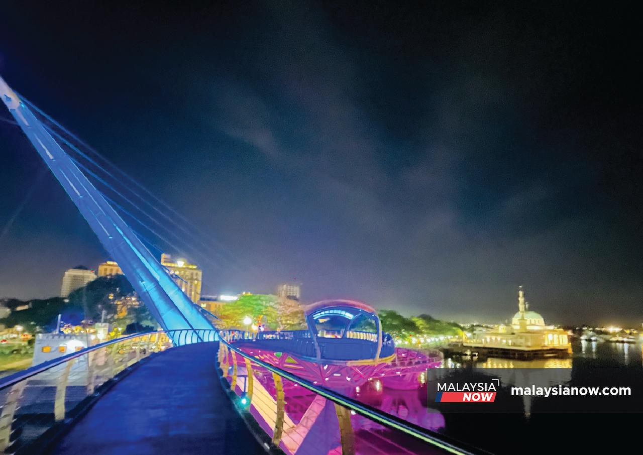 Masjid India Kuching, also known as the Floating Mosque of Kuching, lights up the night sky around it.