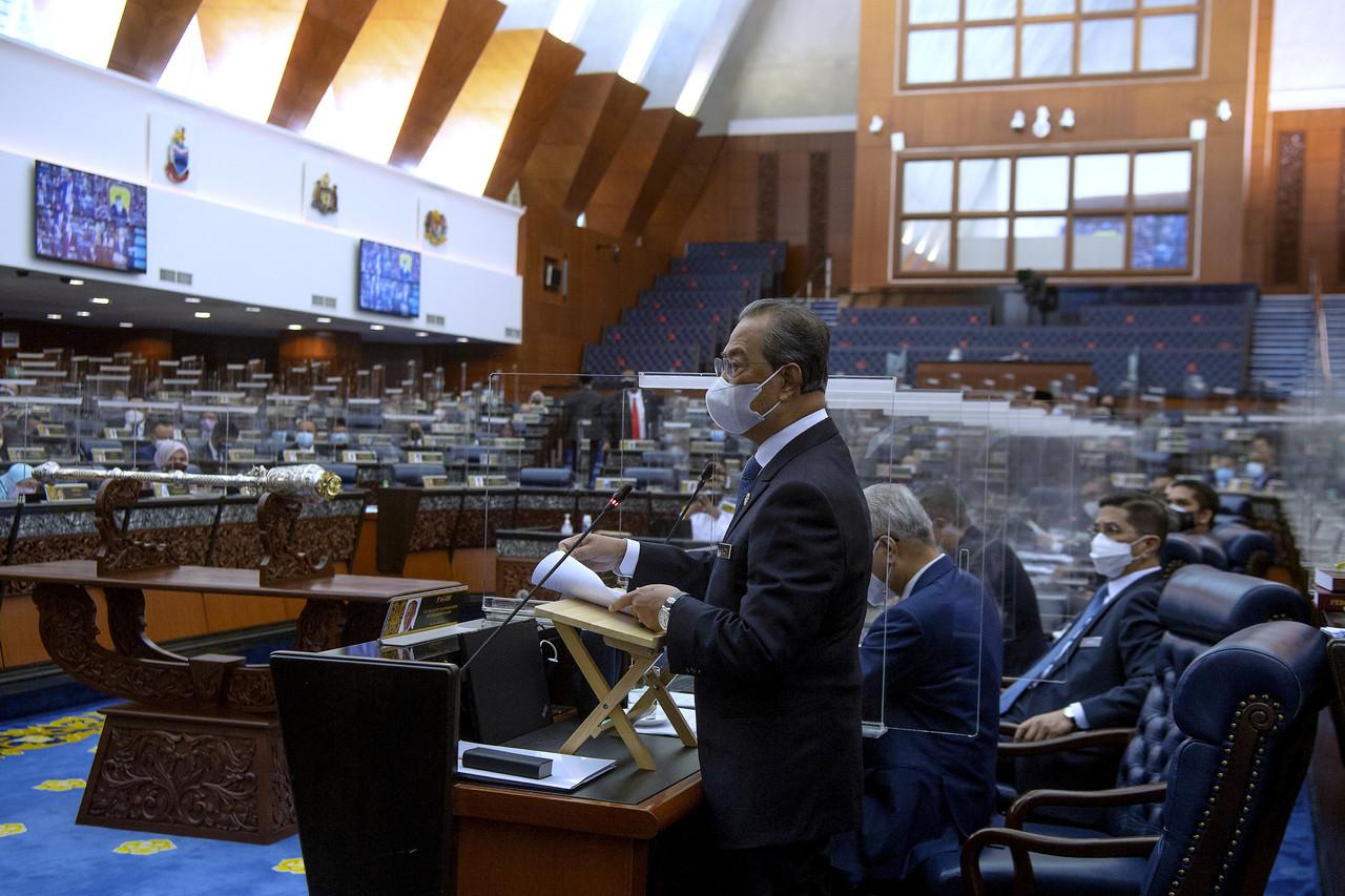 Prime Minister Muhyiddin Yassin speaks on the National Recovery Plan in the Dewan Rakyat today. Photo: Bernama