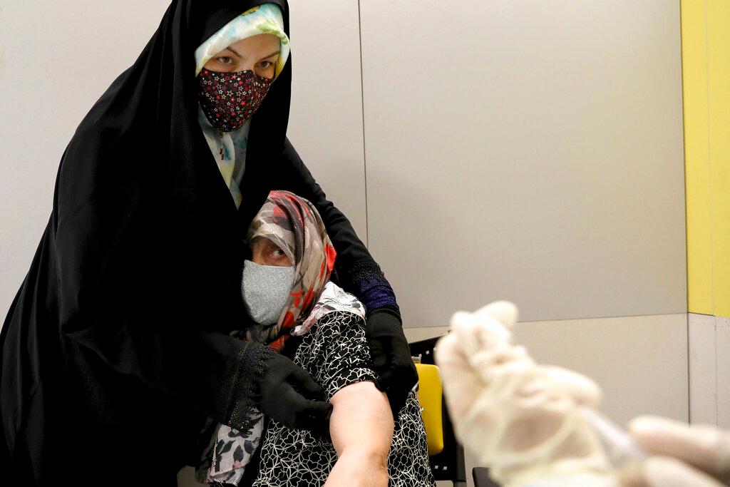 An Iranian woman receives a Sinopharm vaccine for Covid-19 at the Iran Mall shopping centre, in Tehran, Iran, in this May 17 file photo. Photo: AP