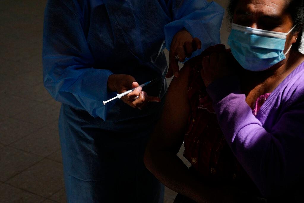 A healthcare worker gives a shot of the Moderna Covid-19 vaccine in San Juan Sacatepequez, Guatemala, July 15. Photo: AP