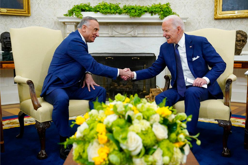 US President Joe Biden (right) shakes hands with Iraqi Prime Minister Mustafa al-Kadhimi during their meeting in the Oval Office of the White House in Washington, July 26. Photo: AP