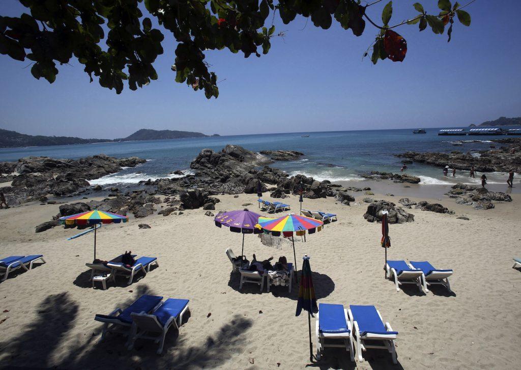 Tourists spend time on Patong Beach in Phuket province, southern Thailand, in this March 13, 2014 file photo. Tourist spending accounted for about 11% of Thai GDP in 2019, before the pandemic. Photo: AP