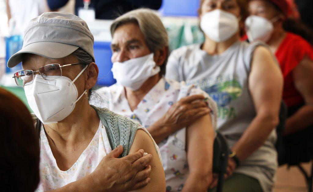 Senior citizens wait in observation after receiving their second dose of Covid-19 vaccine at the University Olympic Stadium in Mexico City, April 12. Photo: AP