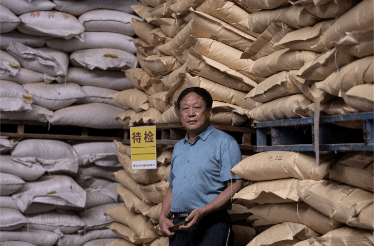 Chinese billionaire Sun Dawu at a feed warehouse in Hebei, outside Beijing. Photo: AFP