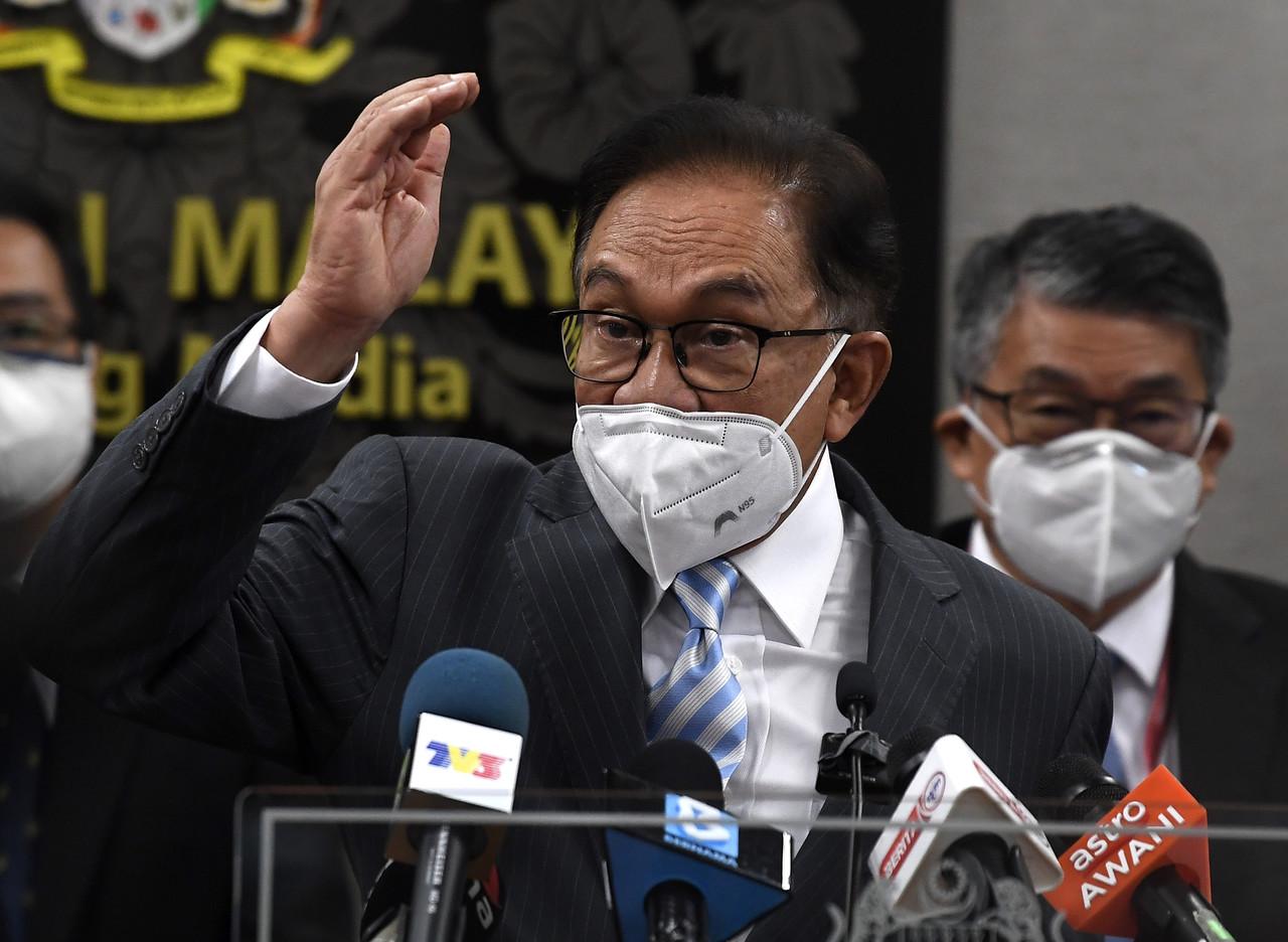 Opposition leader Anwar Ibrahim speaks at a press conference in the Parliament building today. Photo: Bernama