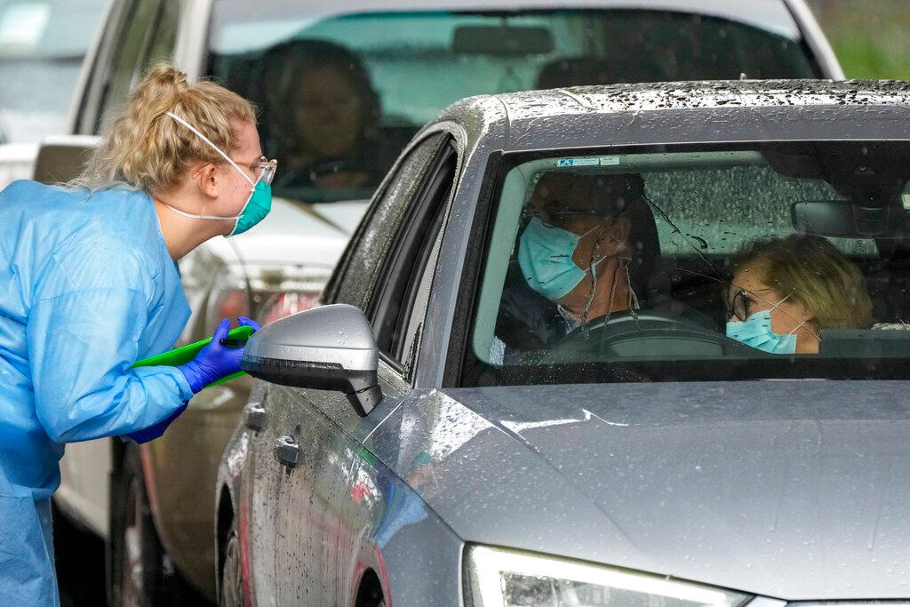 A couple prepares to be swabbed for Covid-19 at a testing station in Nelson Bay, Australia, June 28. Photo: AP
