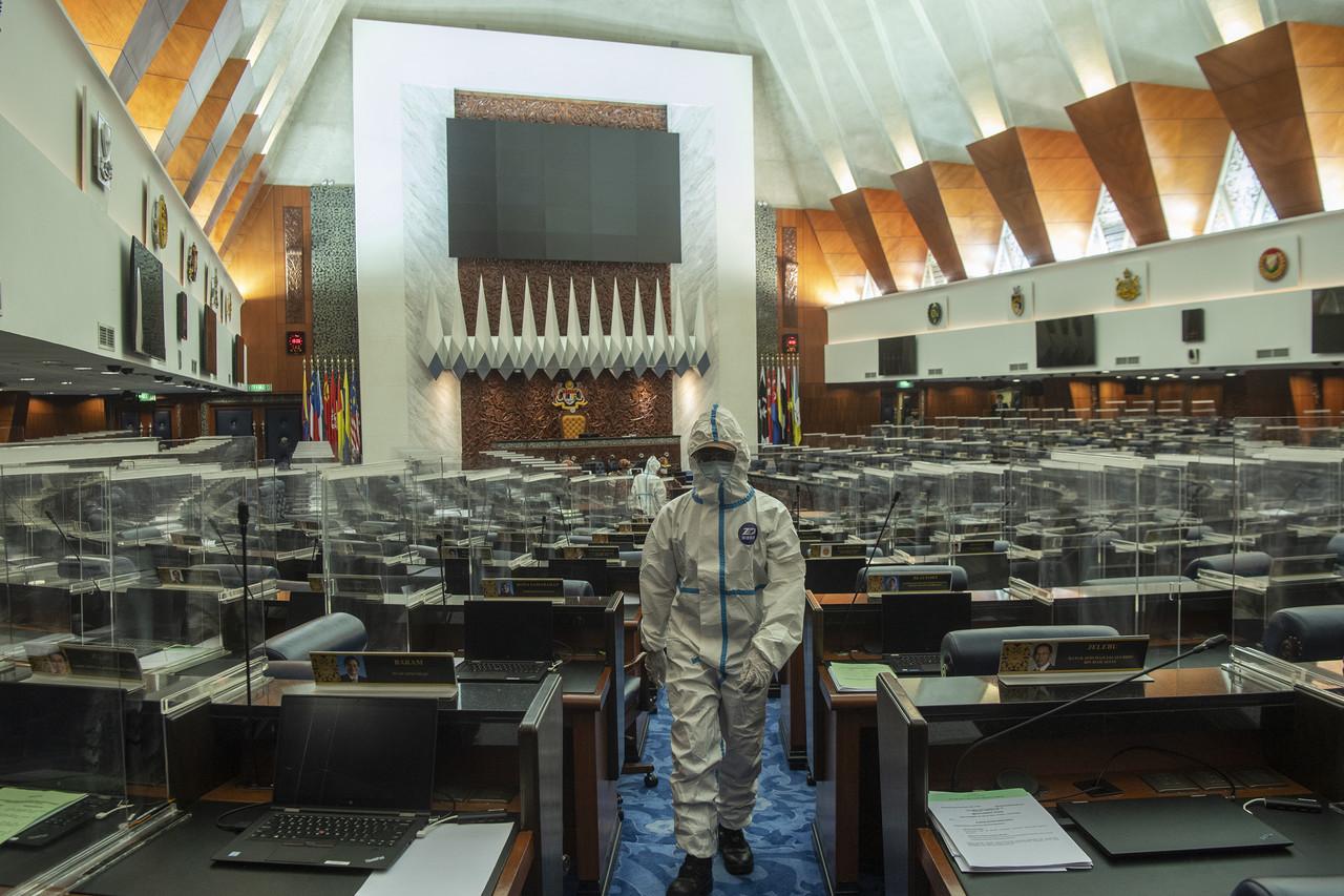 Personnel from the fire and rescue department conduct a cleaning and disinfection exercise at the Dewan Rakyat after several individuals tested positive for Covid-19 on July 29. Photo: Bernama