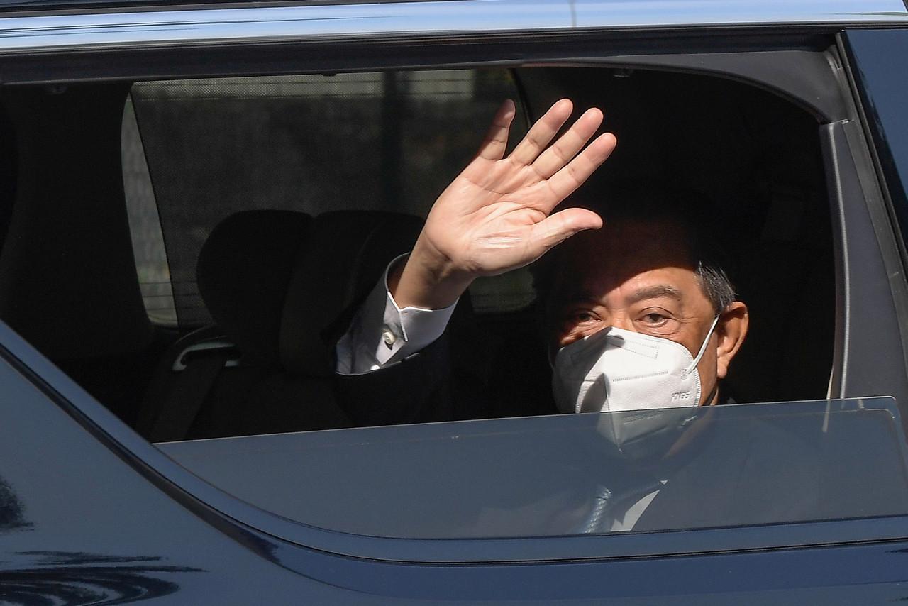 Prime Minister Muhyiddin Yassin waves as he leaves his home in Bukit Damansara, Kuala Lumpur, today. Photo: Bernama